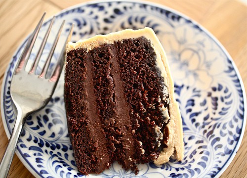 A slice of chocolate cake with salted caramel buttercream.