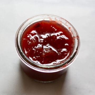 A jar of strawberry rhubarb jam.