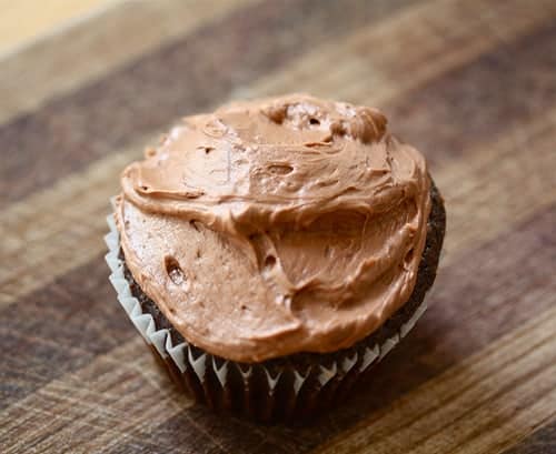 A vegan chocolate cupcake with vegan frosting