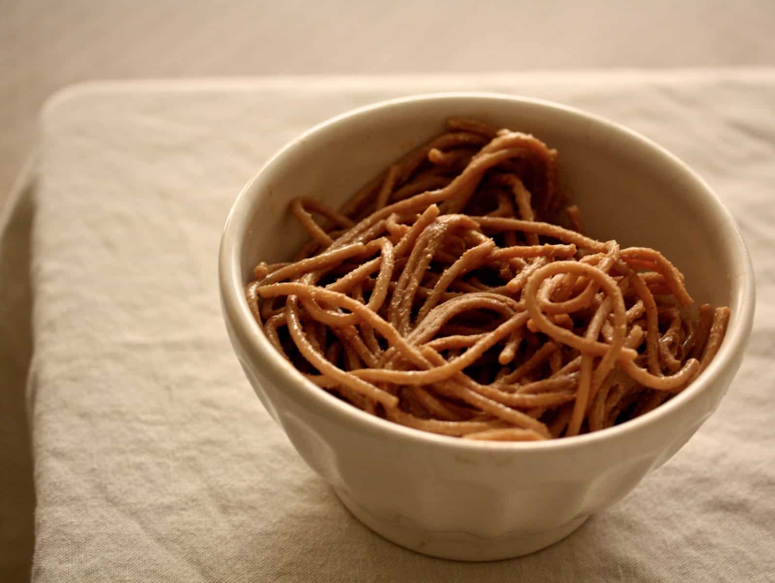 Peanut noodles in a bowl.