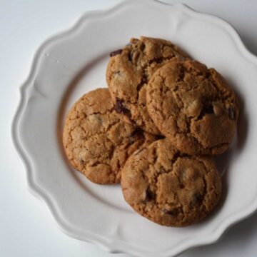 Whole wheat chocolate chip cookies on a plate.
