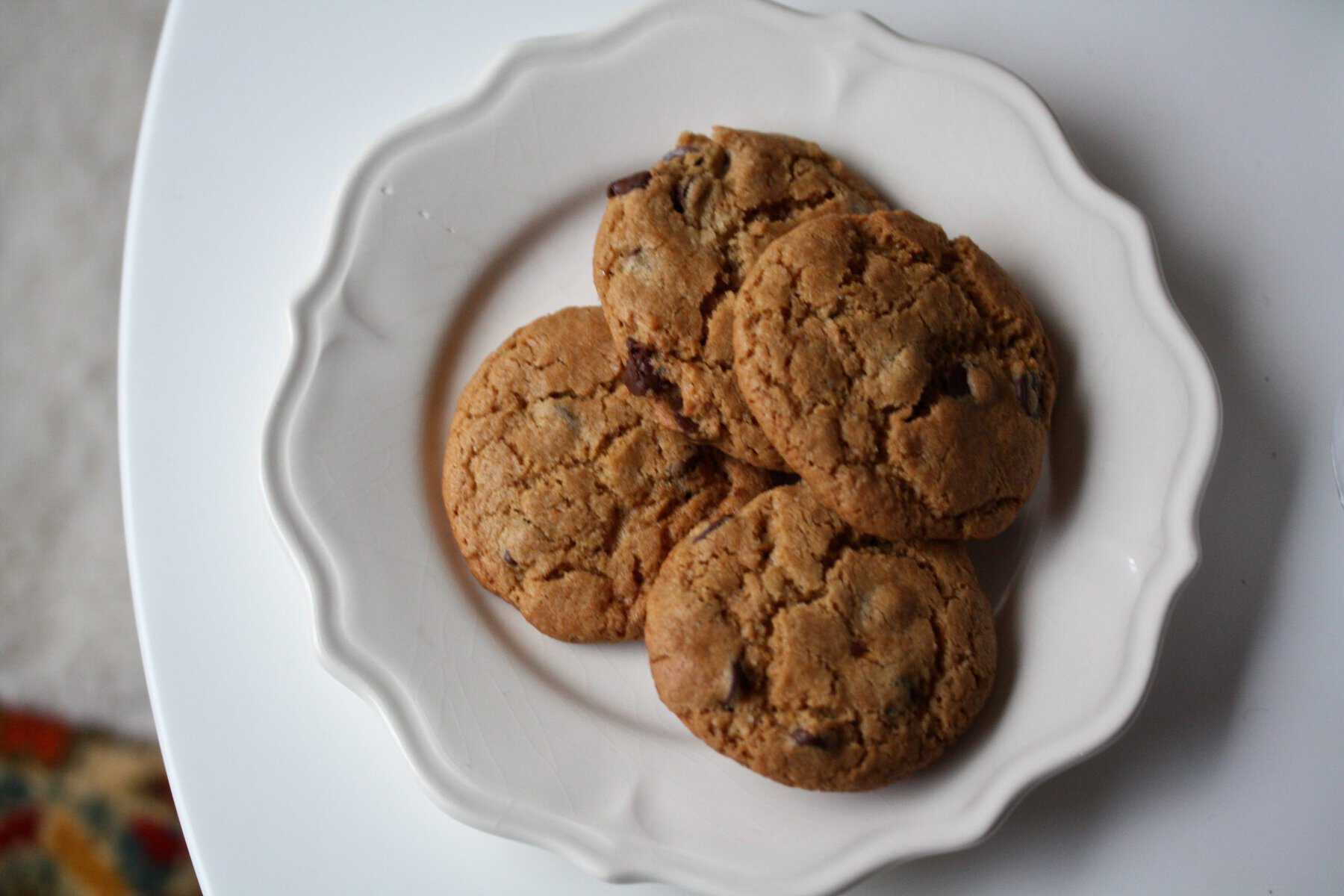 Whole wheat chocolate chip cookies on a plate.