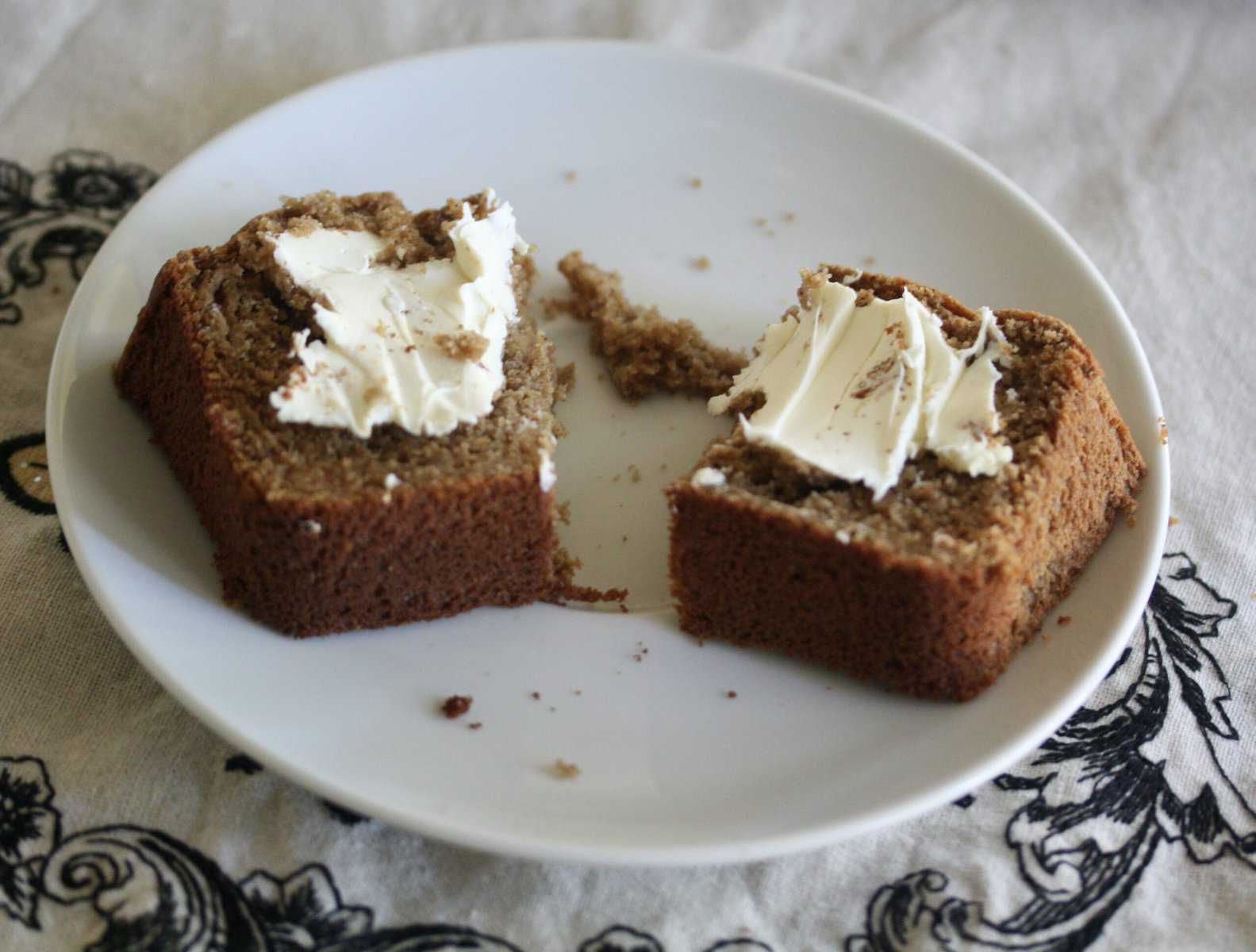 Gluten-Free Applesauce Bread with cream cheese on a plate.