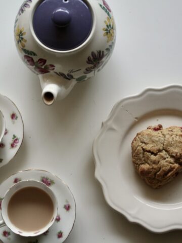 Gluten-free cranberry-orange scones and a pot of tea.
