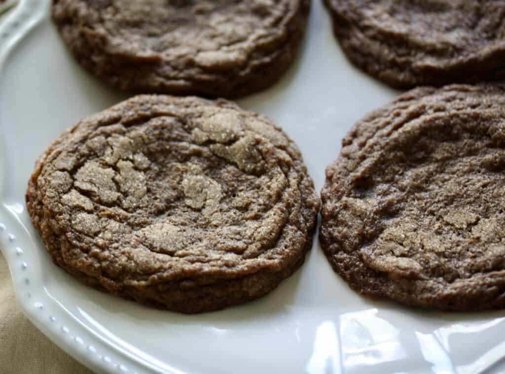 Gluten-free chewy molasses cookies on a plate.