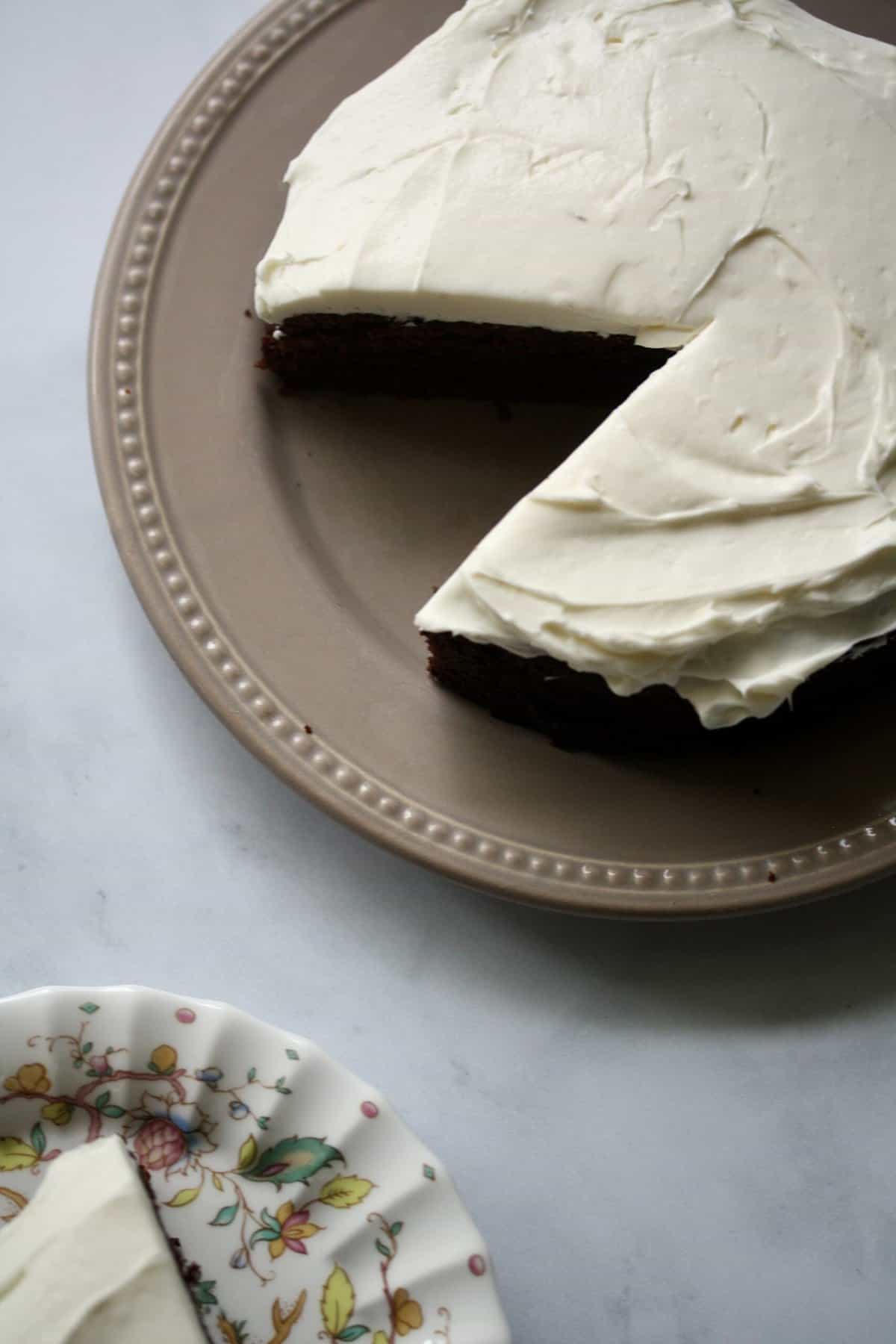 Gluten-free stout cake topped with cream cheese frosting.