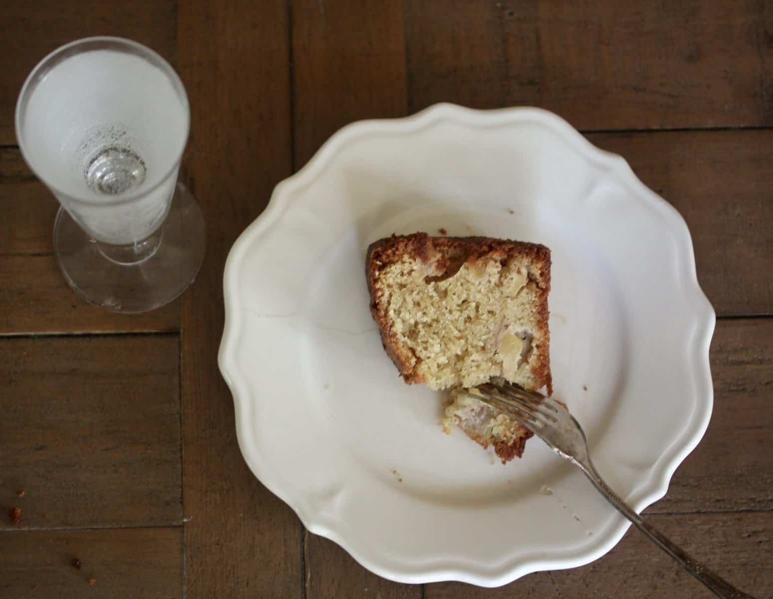 An overview shot of a plate with a piece of gluten-free pear cake.