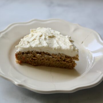 A slice of gluten-free carrot cake on a plate.