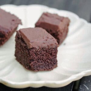 Pieces of teff flour chocolate cake on a plate.