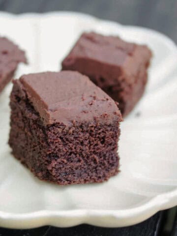 Pieces of teff flour chocolate cake on a plate.