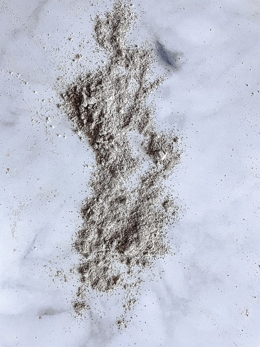 Buckwheat flour is shown on a white background.