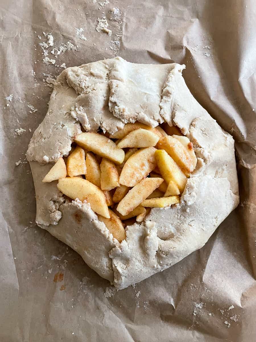 A top down shot of an apple galette before being baked.