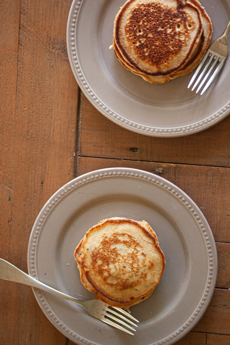 Two plates of oat flour pancakes.