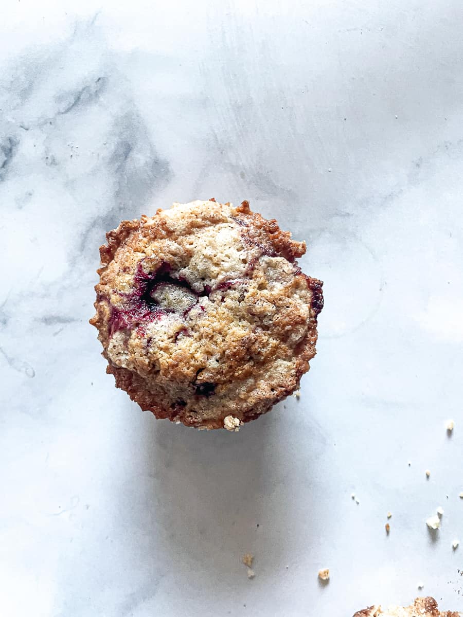 A top down photo shows a blackberry muffin.