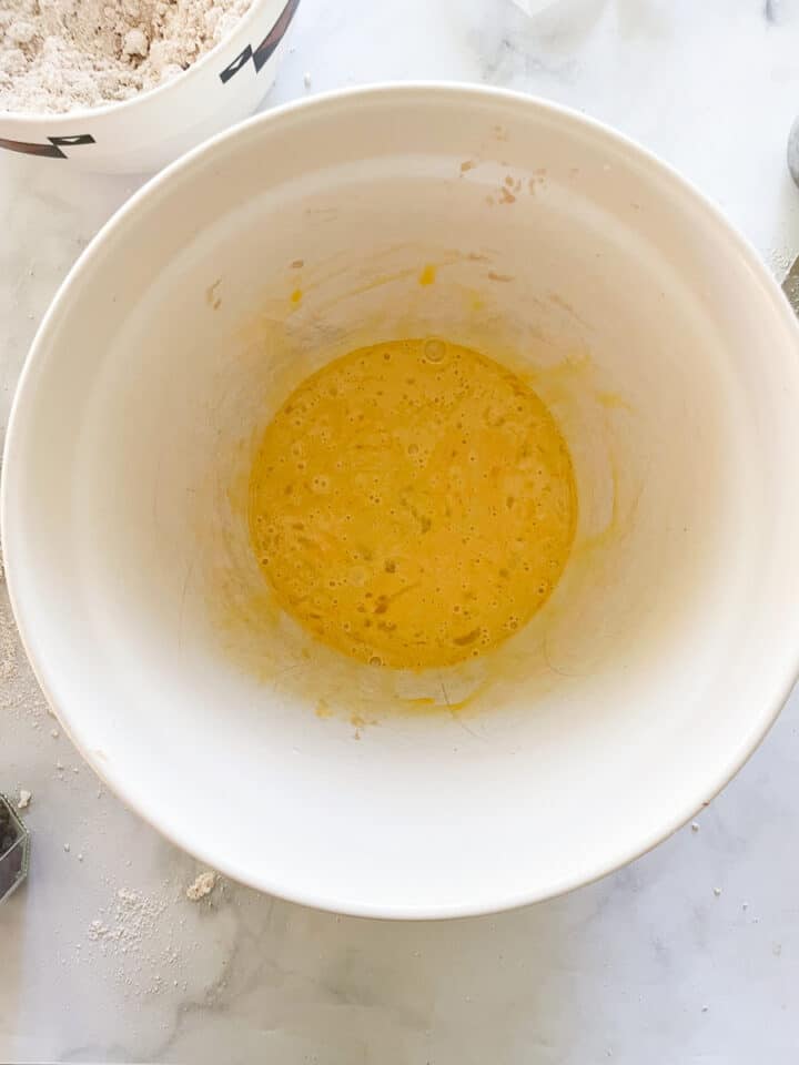 Beaten eggs in a bowl.