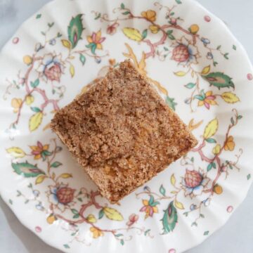 A top down shot of a piece of gluten free coffee cake on a plate.