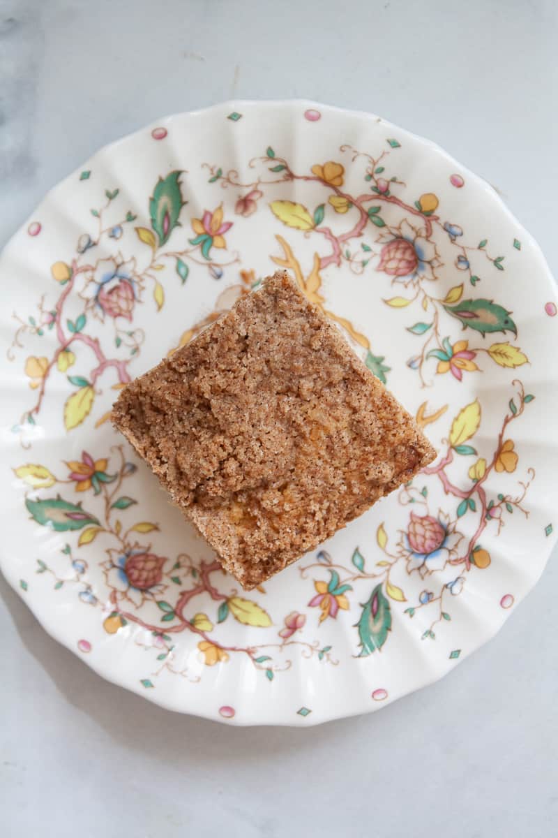 A top down shot of a piece of gluten free coffee cake on a plate.