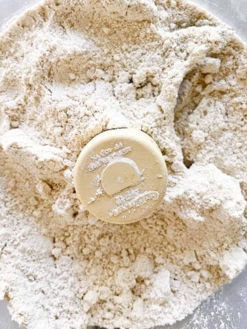 A close up of oat flour in a food processor.