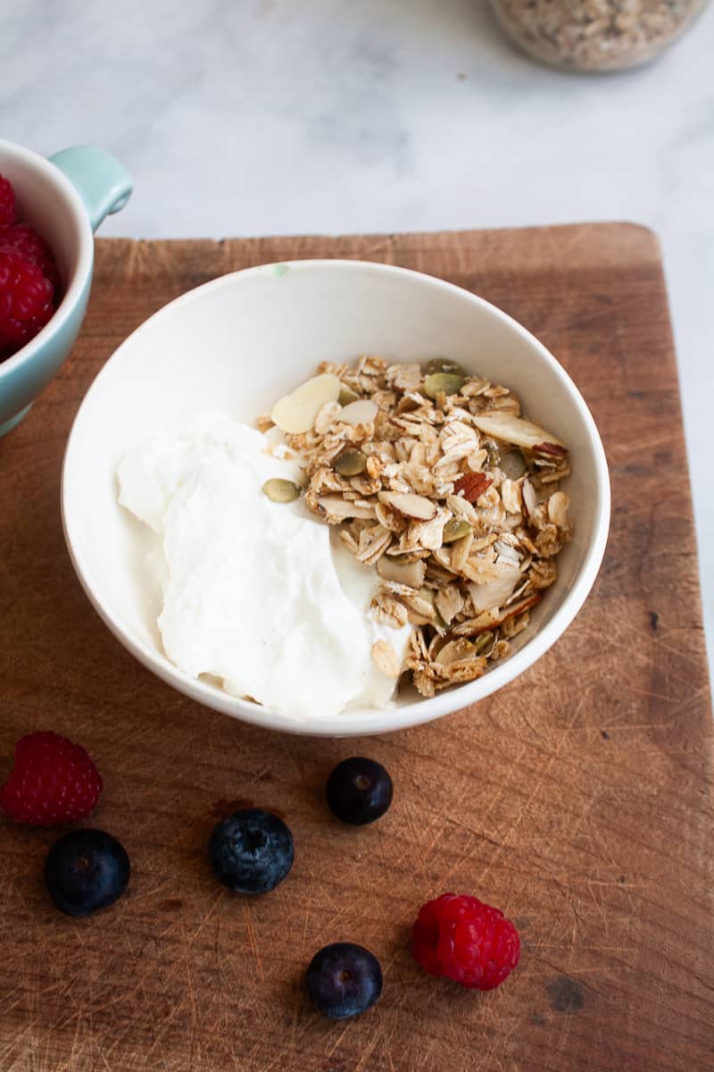 A bowl of gluten-free granola and yogurt.