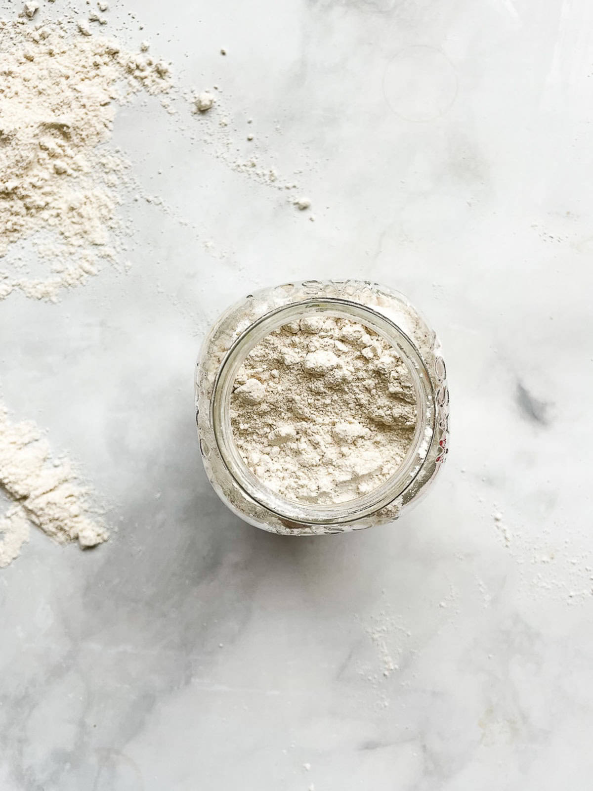 A jar of homemade gluten free flour blend.