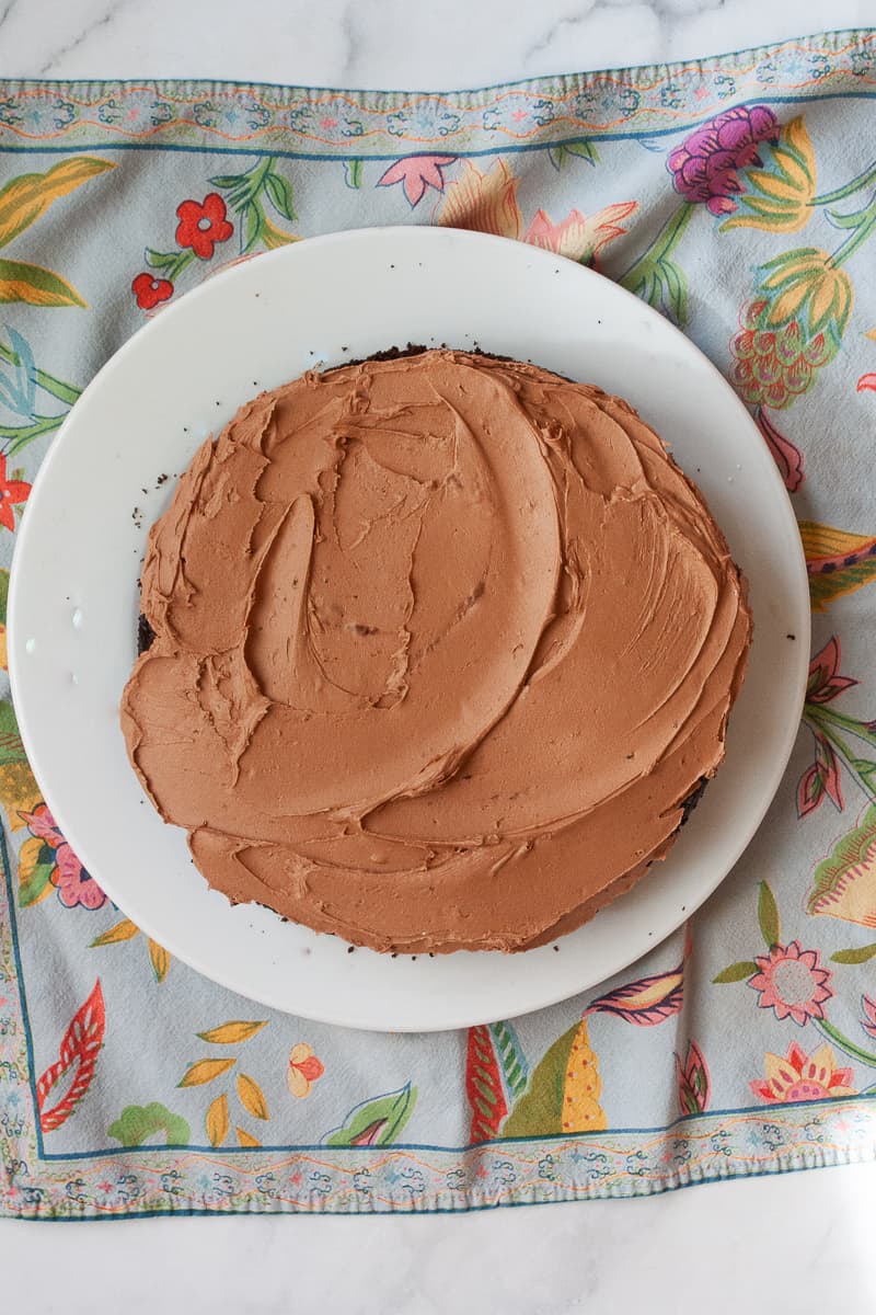 An oat flour chocolate cake on a plate.