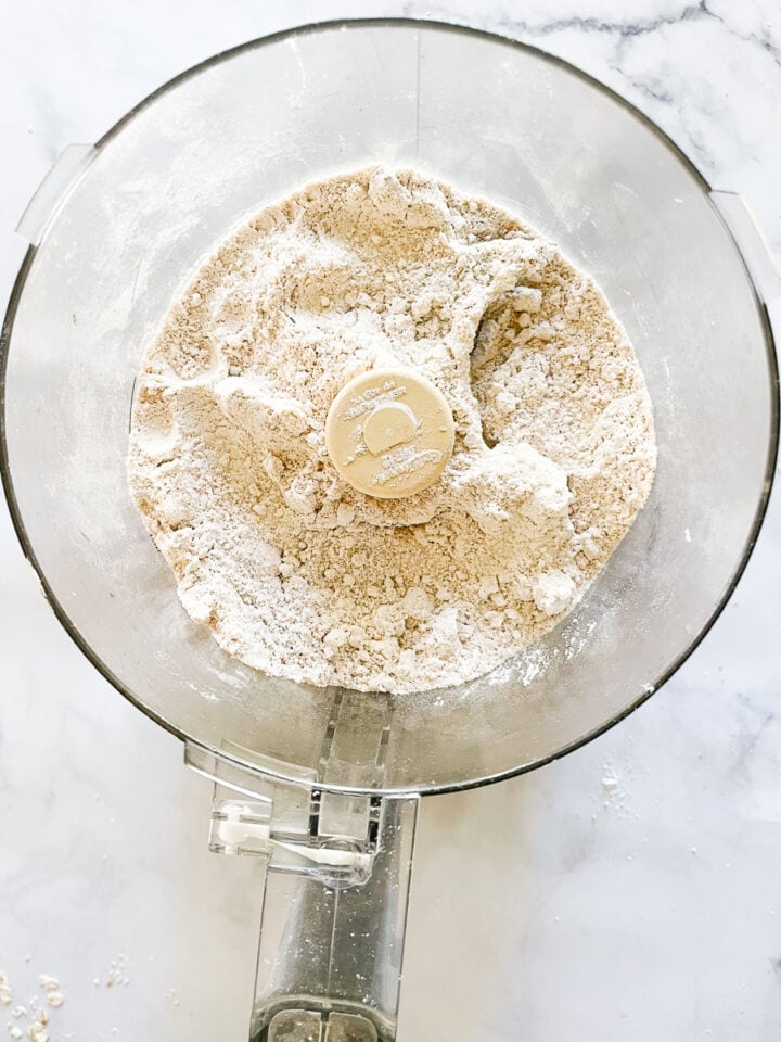 Oat flour in a food processor after being processed.