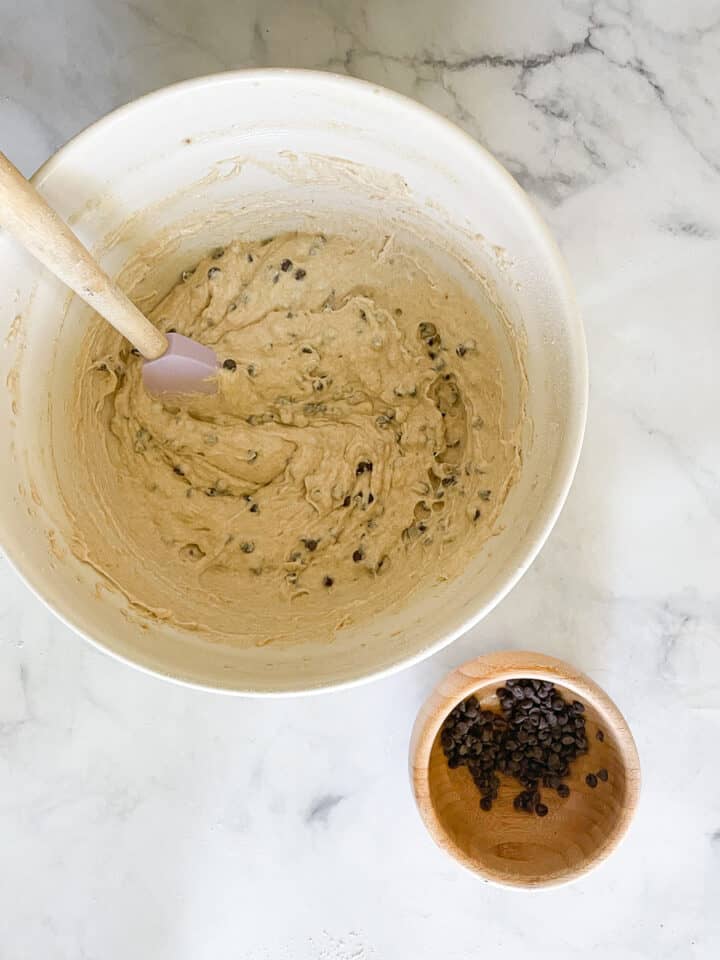 The chocolate chips are stirred into the batter.