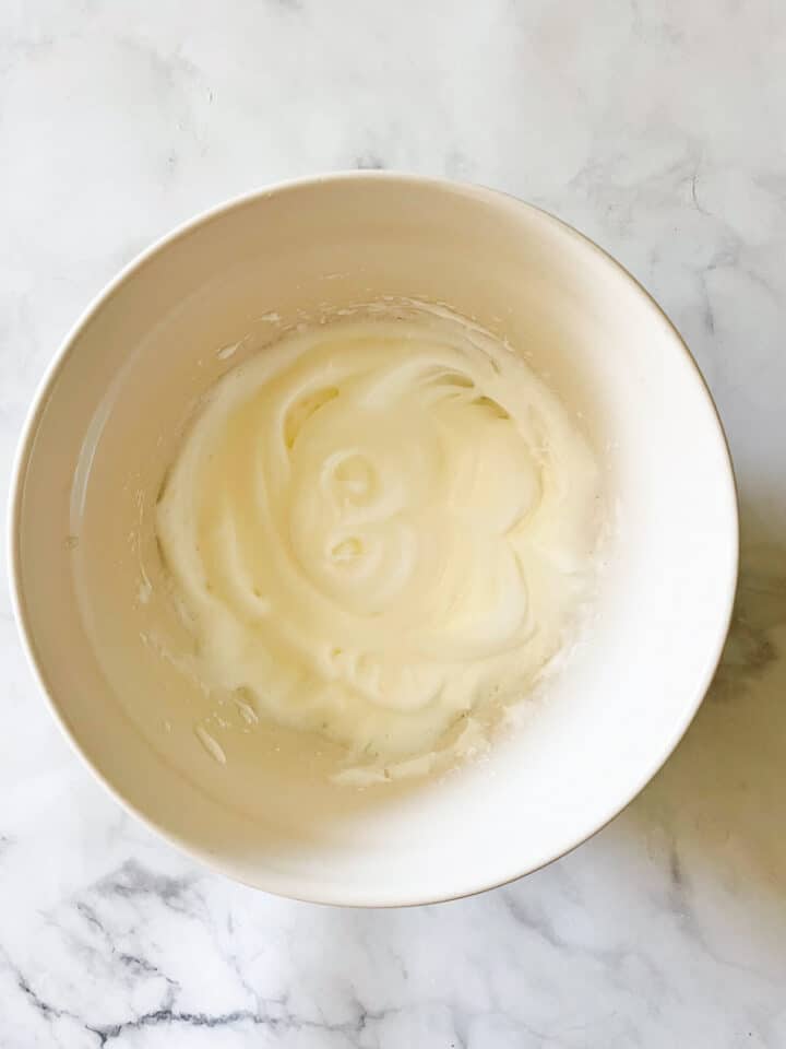 Whipped egg whites in a bowl.