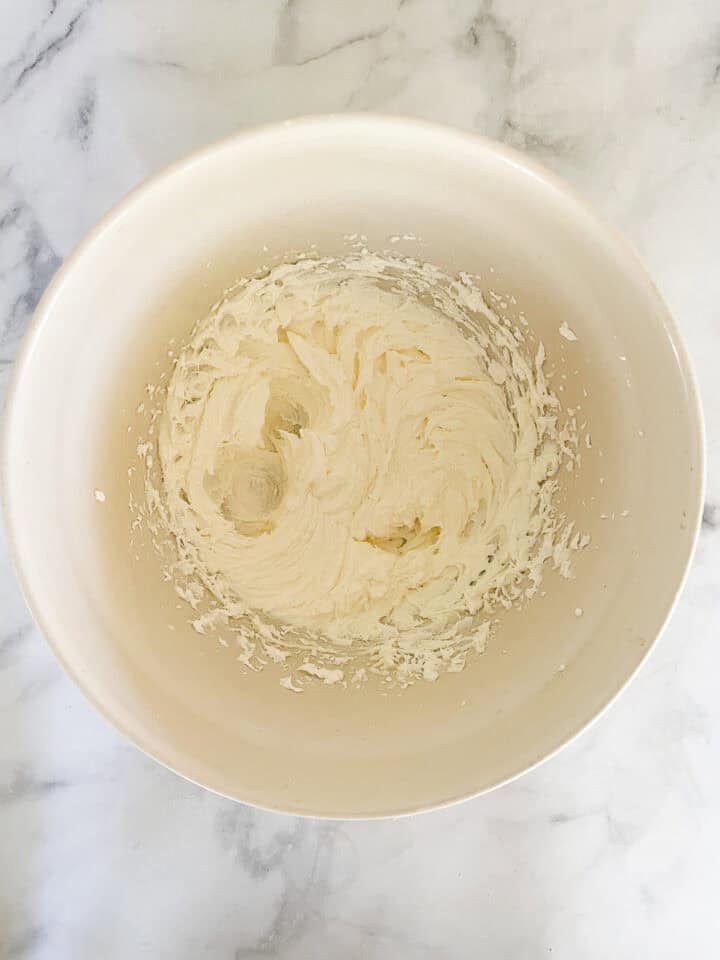 The creamed butter and sugar in a bowl.