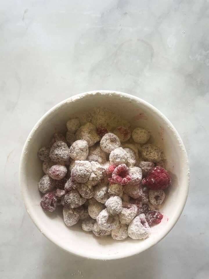 Raspberries are tossed with a little gluten free flour.
