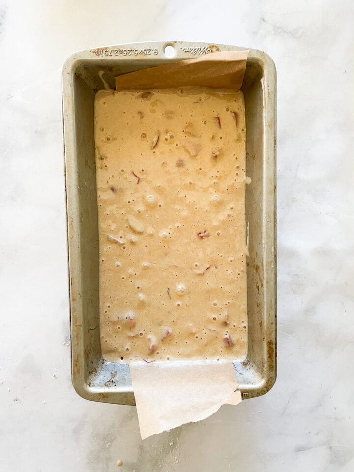 The batter for rhubarb bread in a loaf pan.