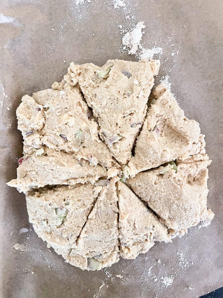 Eight scones are cut out of the dough.