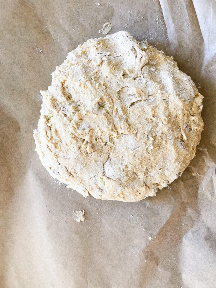 Rhubarb scone dough is formed into a circle.