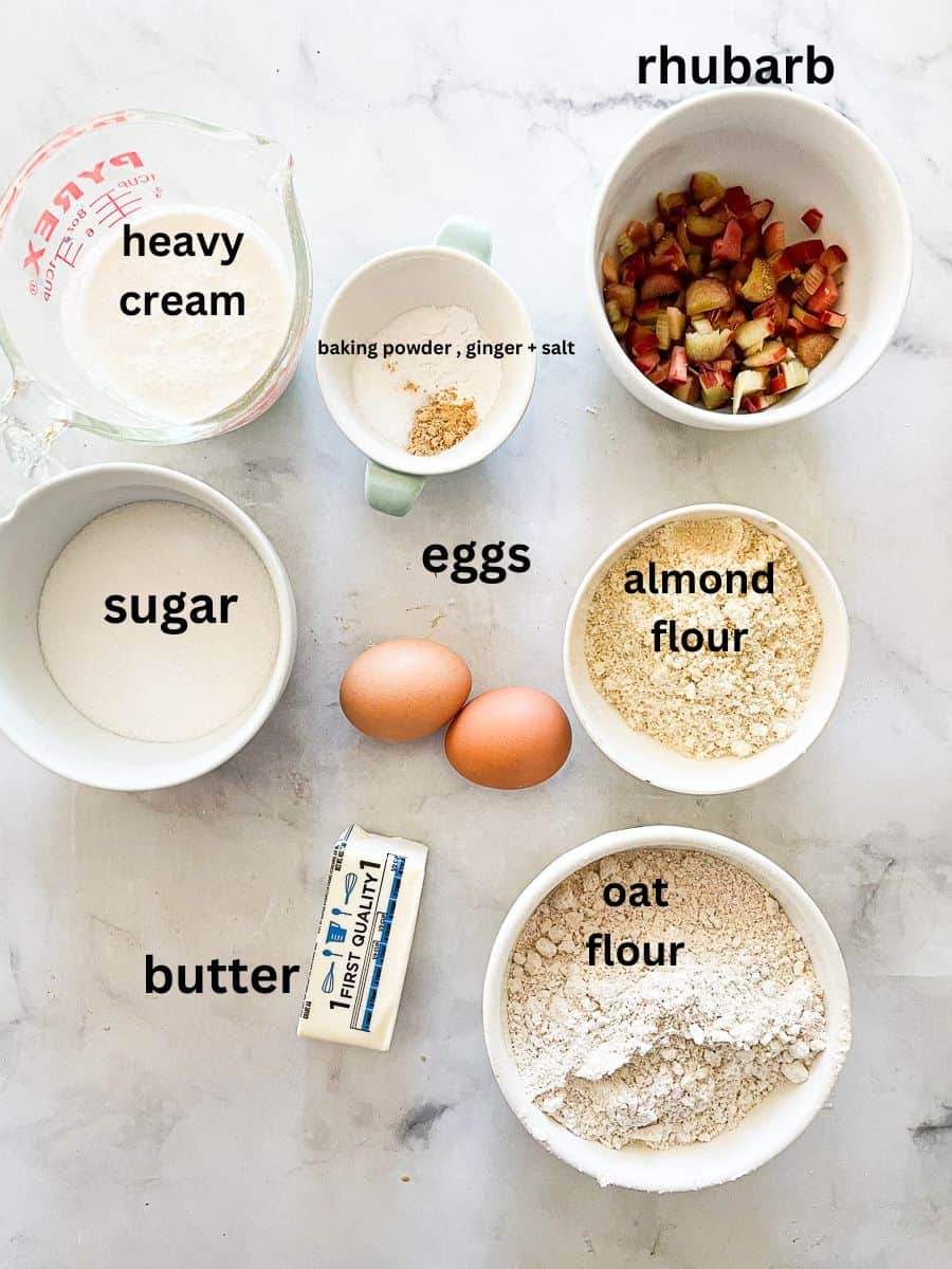 Rhubarb scone ingredients labelled: oat flour, almond flour, heavy cream, rhubarb, eggs, sugar, baking powder, salt, ginger, butter.