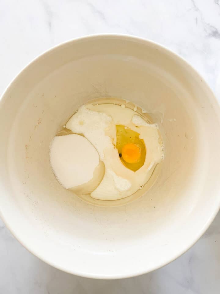 The egg, sugar, and buttermilk are placed in a bowl.