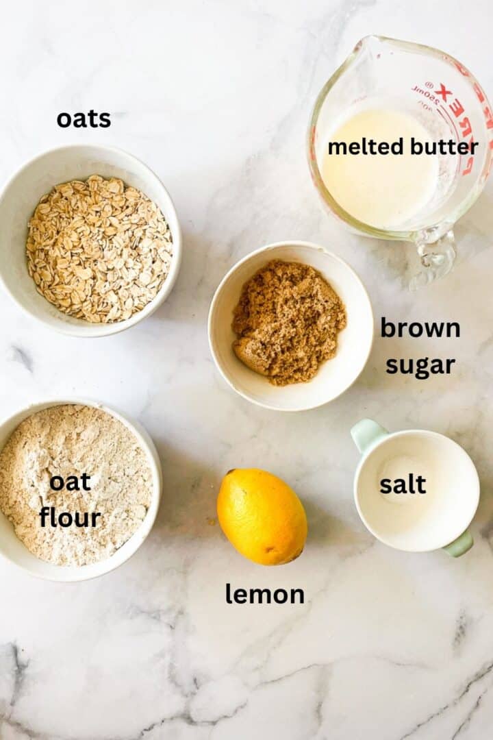 Ingredients for blueberry crisp topping: oats, butter, oat flour, brown sugar, lemon, salt.