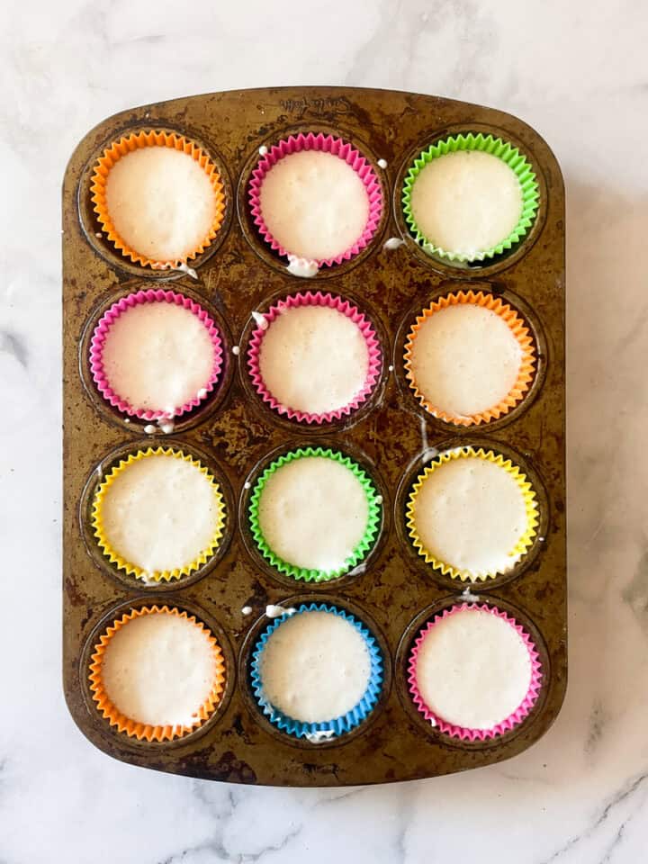 Batter is placed in the cupcake tin.