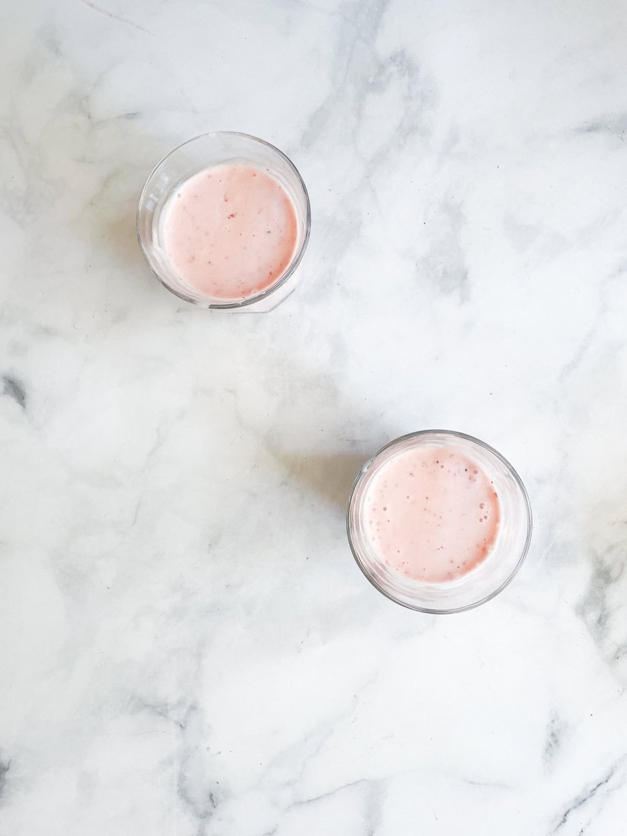 Two glasses of banan strawberry smoothie.