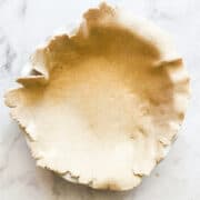 Oat flour pie crust in a pie pan.
