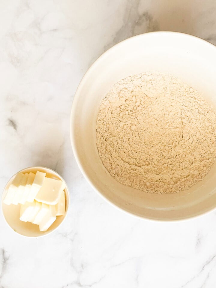 Butter is next to the flour mix for oat flour pie dough.