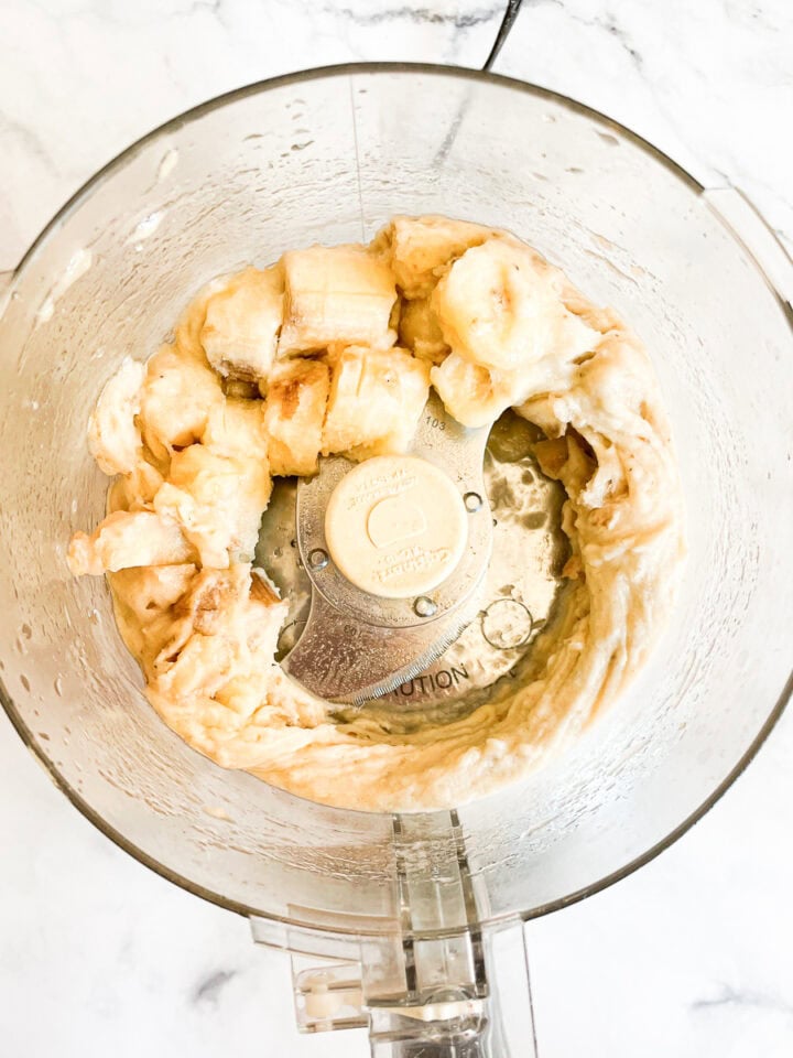 The bananas start to break down in the food processor.