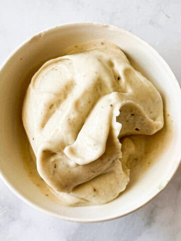 Banana ice cream is served in a bowl.