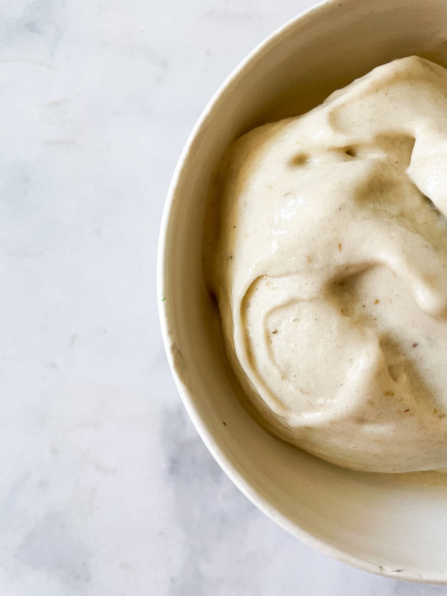 Banana ice cream is served in a bowl.