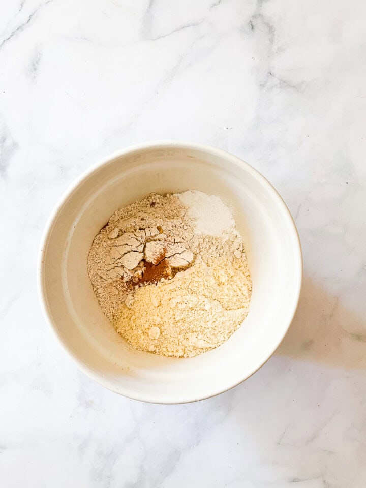 Dry mix for banana zucchini muffins in a bowl.