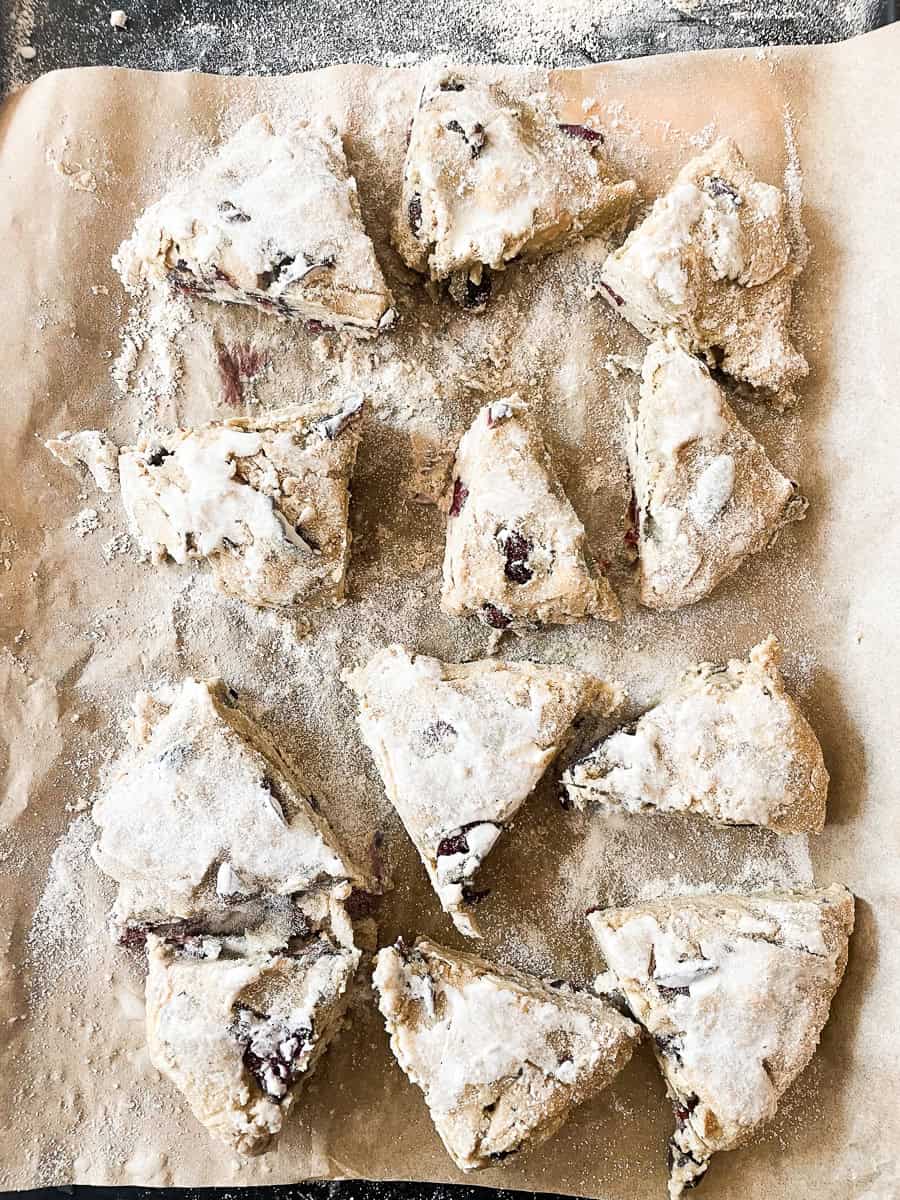 Scones are brushed with cream before being baking.