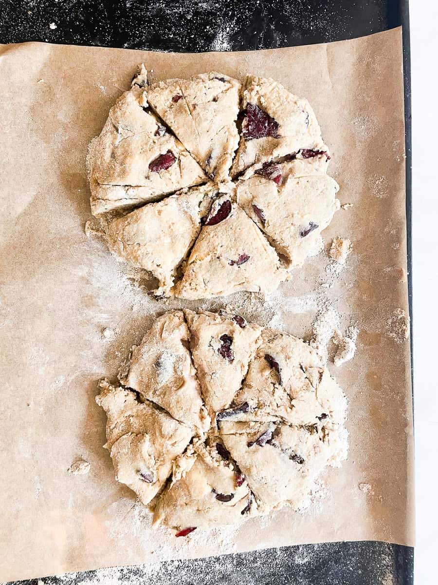 Scones are formed on a baking sheet.