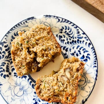 A plate with two pieces of zucchini bread.