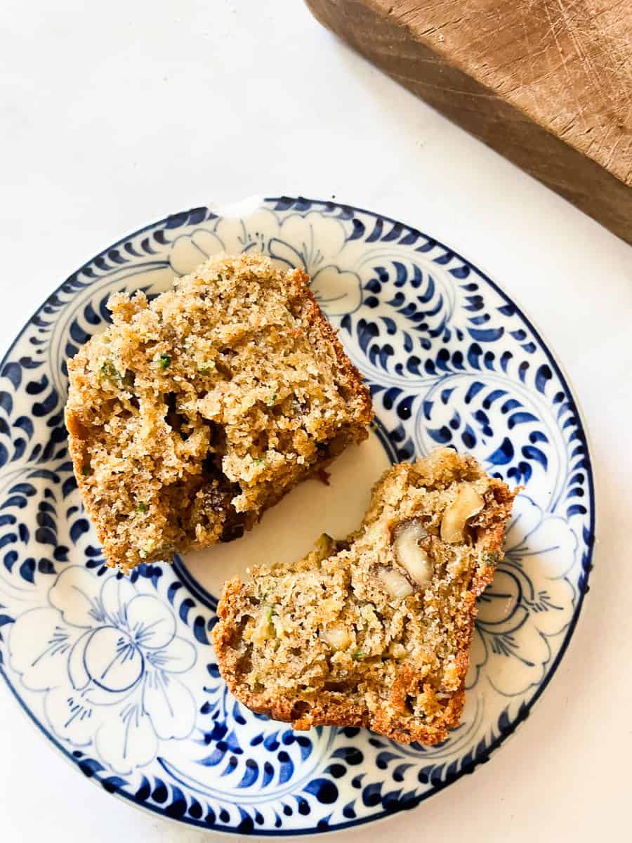 A plate with two pieces of zucchini bread.