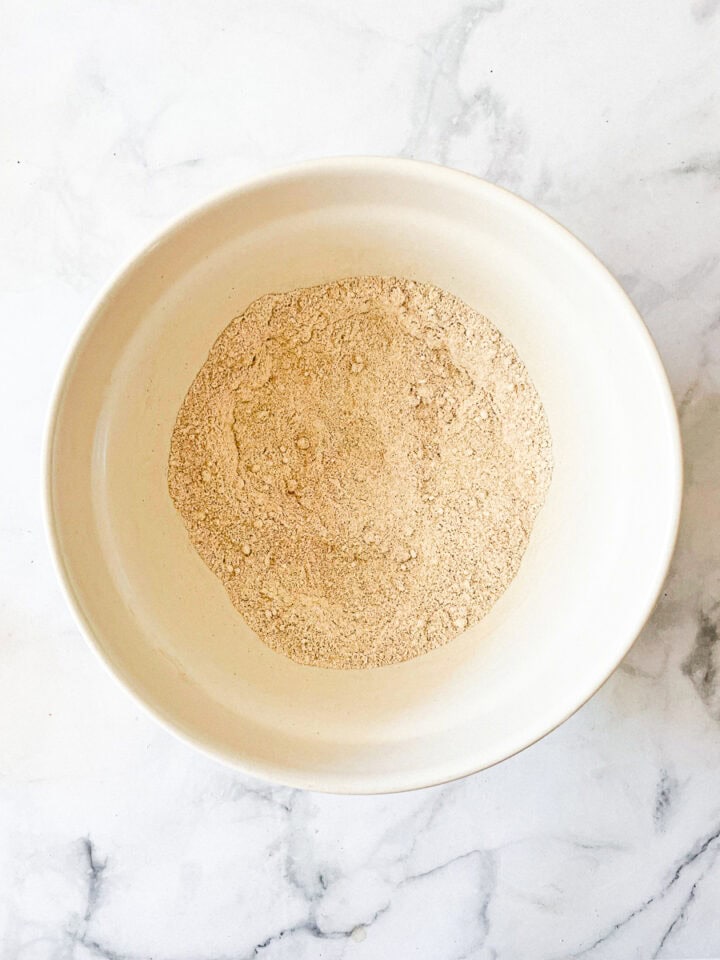 The dry mix for gluten-free zucchini bread in a bowl.