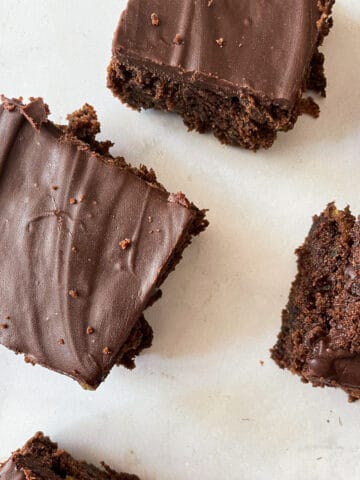 Squares of gluten zucchini chocolate cake.